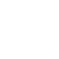 Dentist in white coat examining patient's teeth in modern dental office setting.