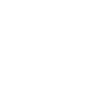 Dentist in white coat examining patient's teeth in modern dental office setting.