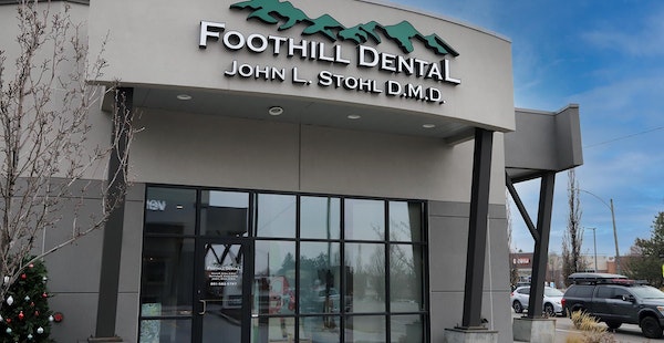 Foothill Dental storefront exterior with signage, large windows, and modern building facade on clear day.